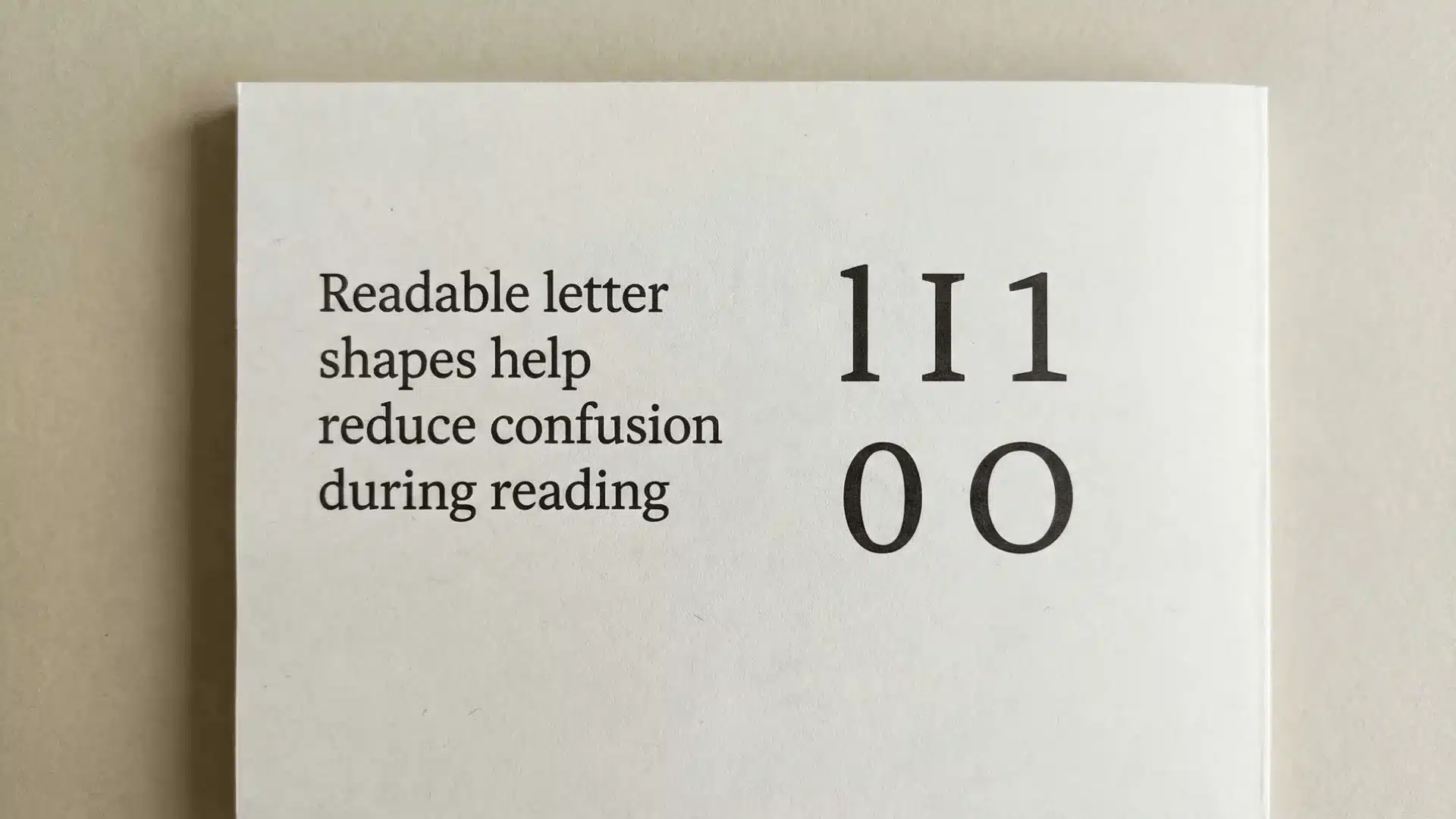 Printed sheet showing sentence text and rows of characters used to compare letter clarity