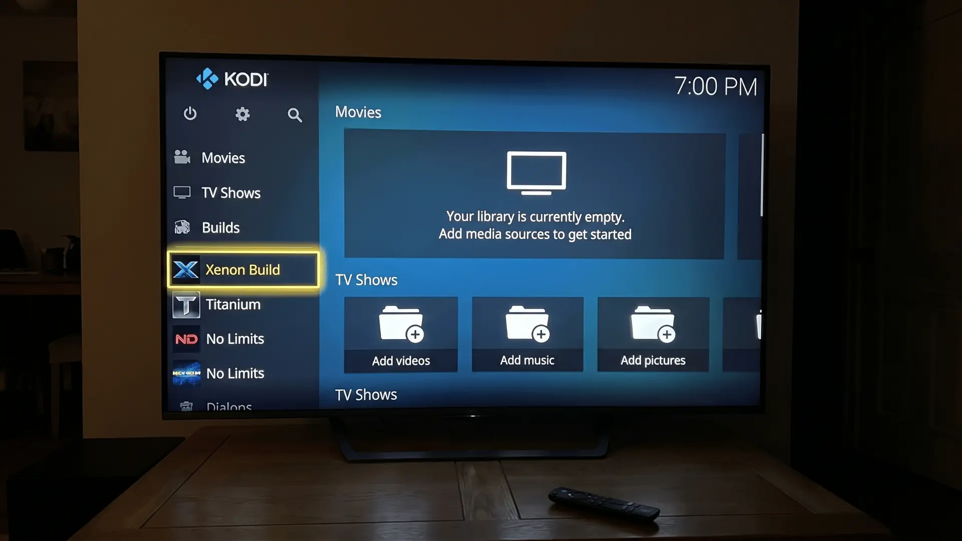 Kodi home screen on Firestick with empty library and options to add media or install a build.