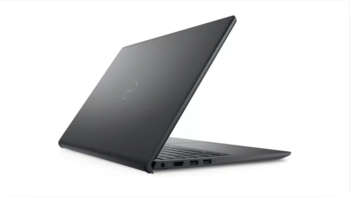 Dell Inspiron laptop closed at angle showing rear hinge design and side ports on dark finish