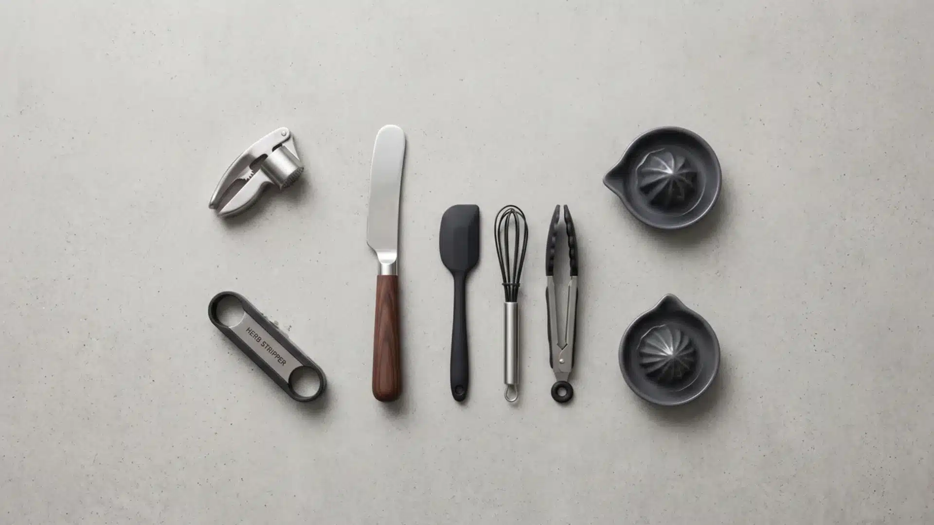 compact kitchen tools arranged on countertop including small prep gadgets and utensils