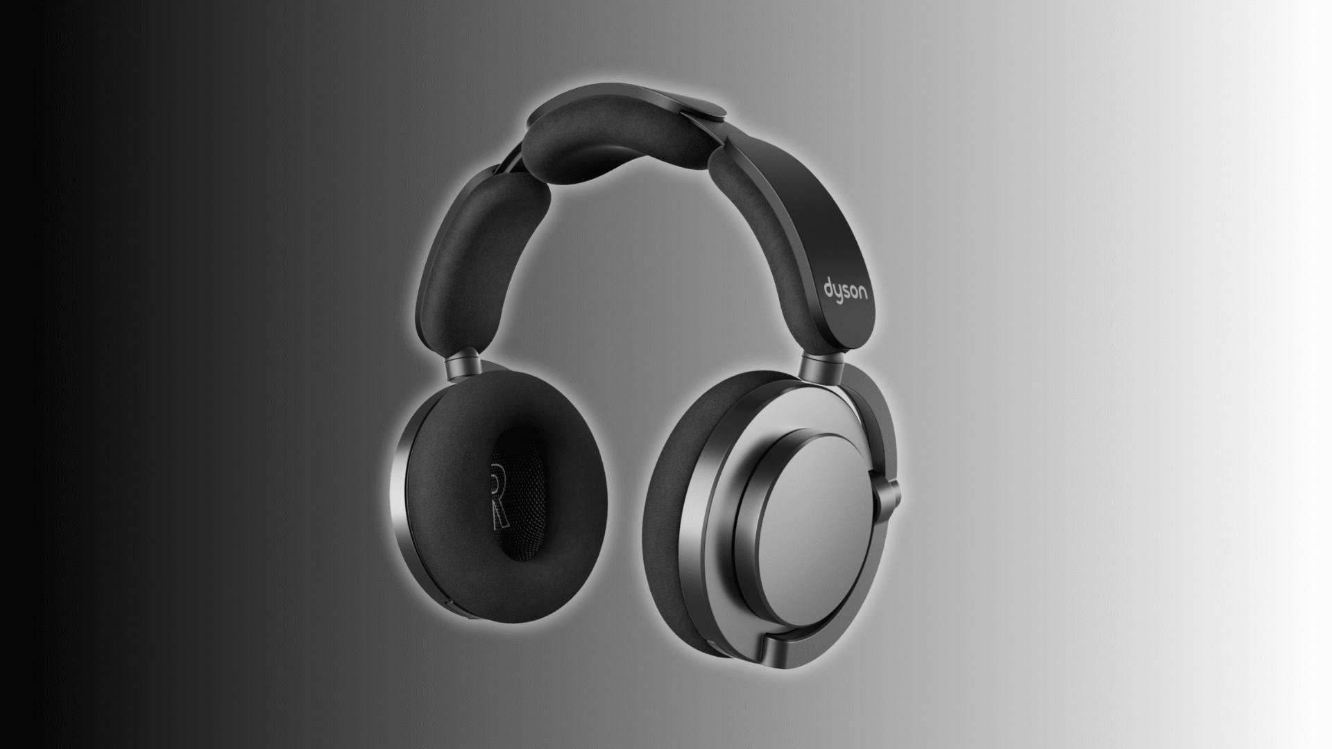 Dyson OnTrac headphones with black cushions and silver ear cups on a dark gradient studio background.