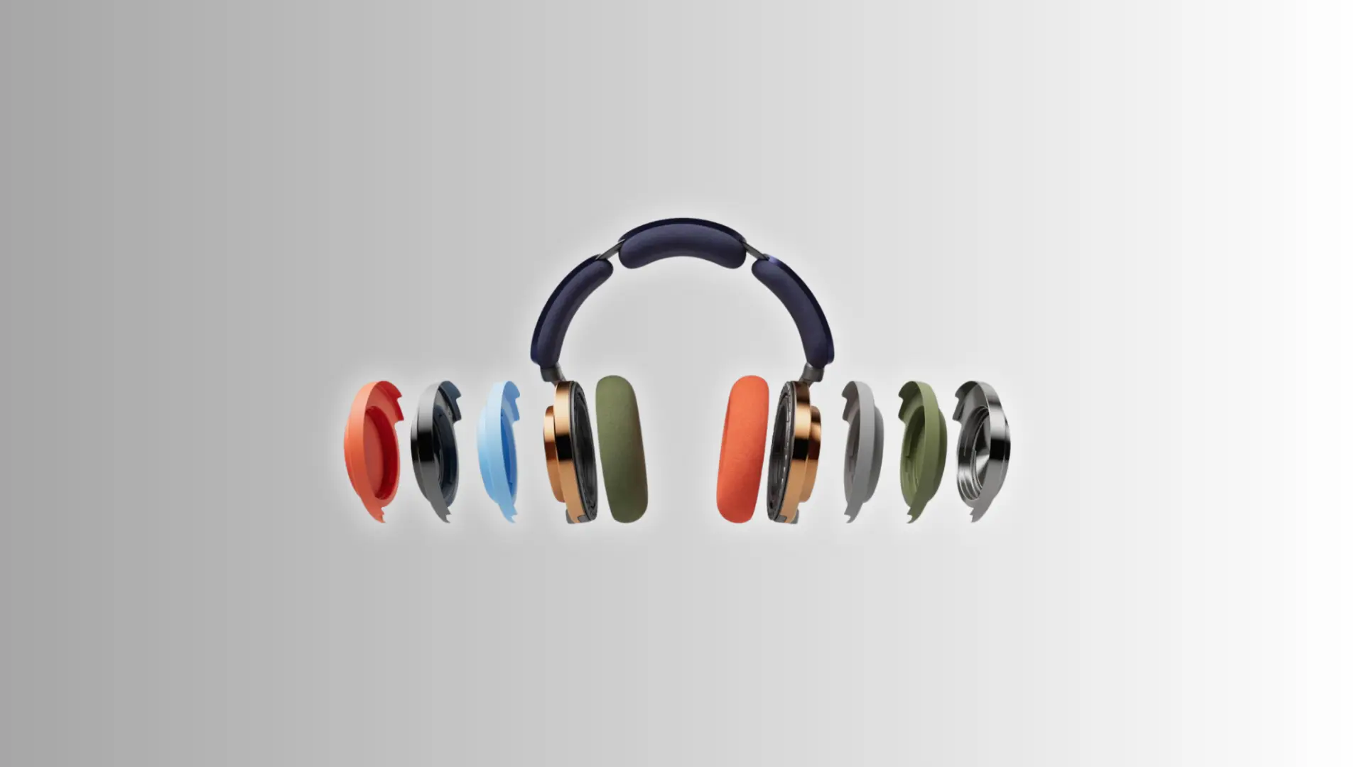 Dyson OnTrac headphones with interchangeable colorful ear cup covers displayed on a clean studio background.