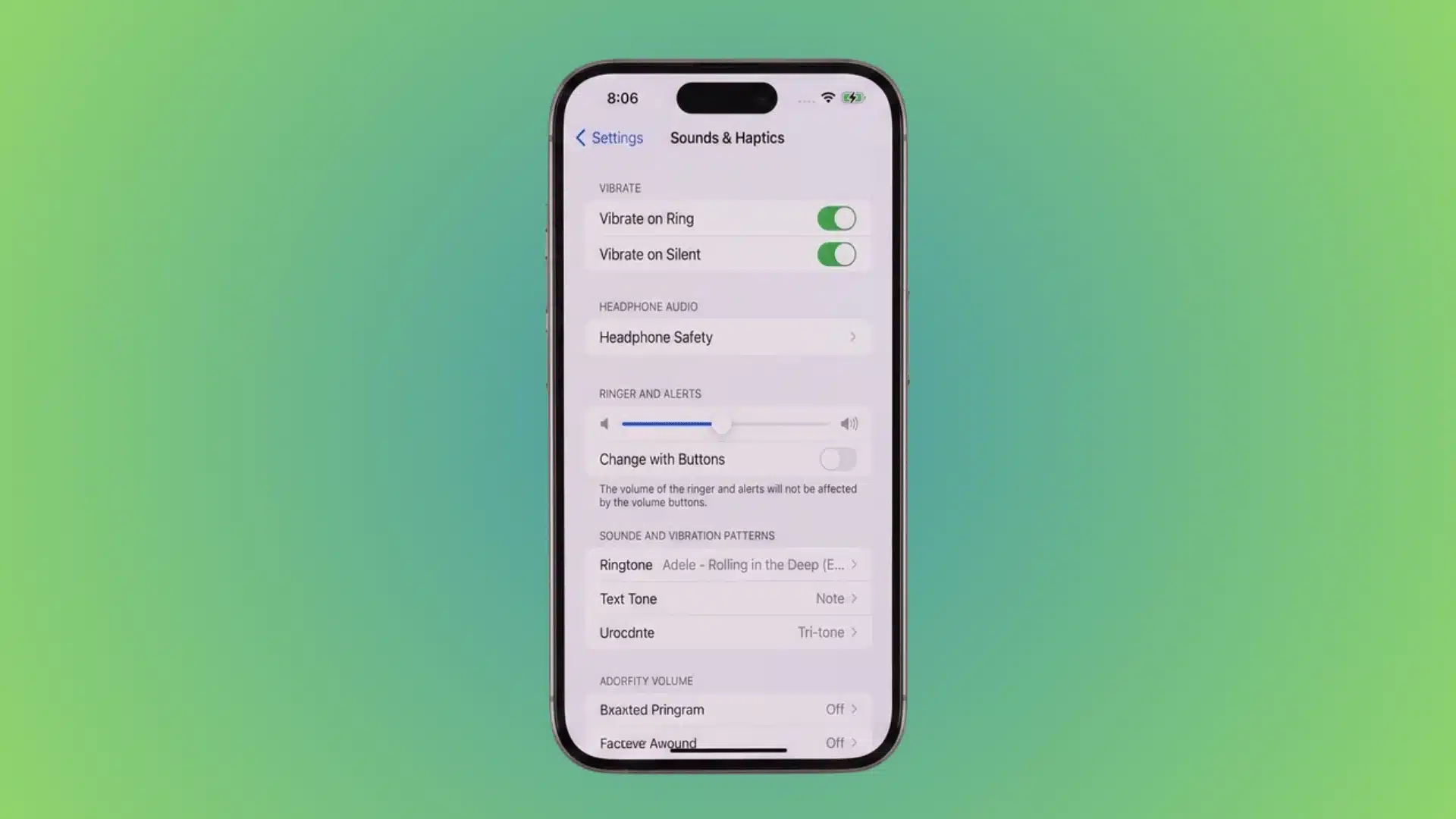 iPhone Settings Sounds & Haptics page with ringtone volume adjustment controls.