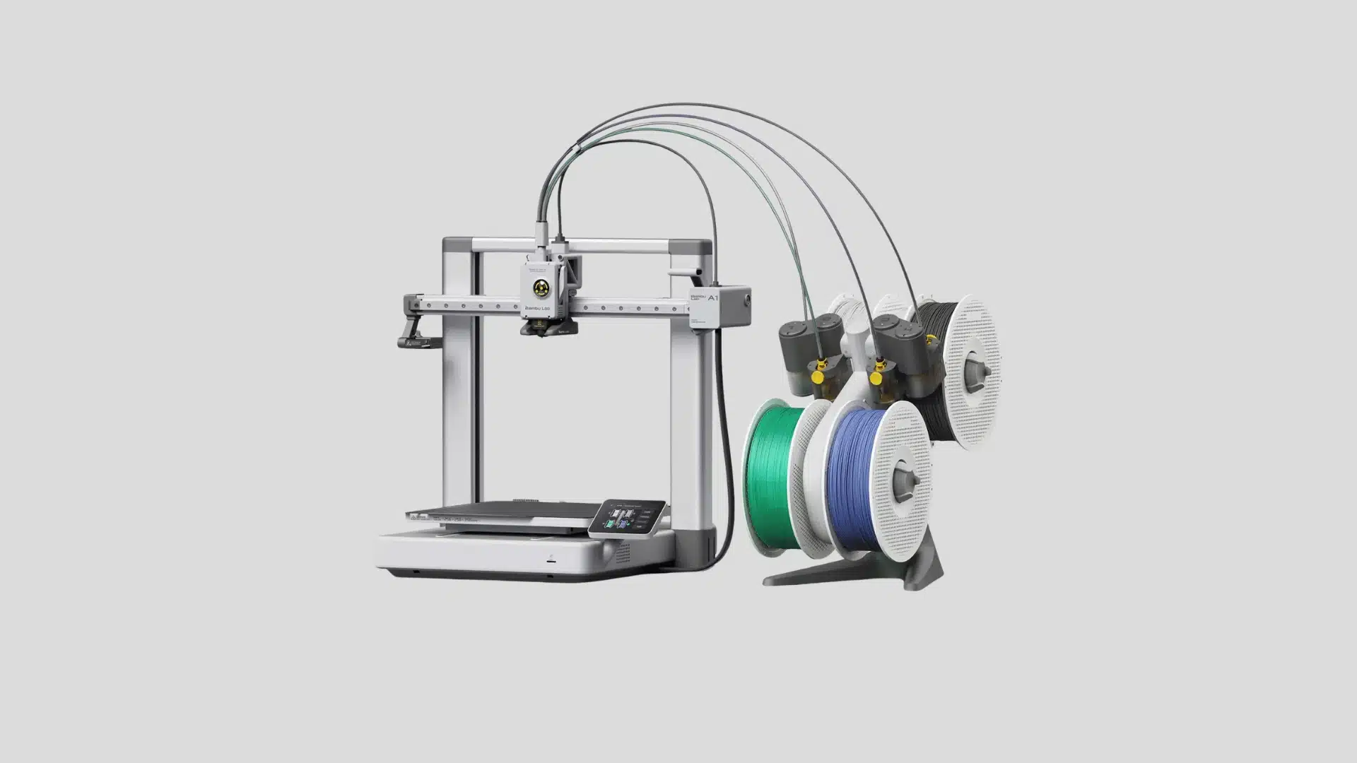 Bambu Lab A1 3D printer connected to four filament spools on an AMS Lite stand