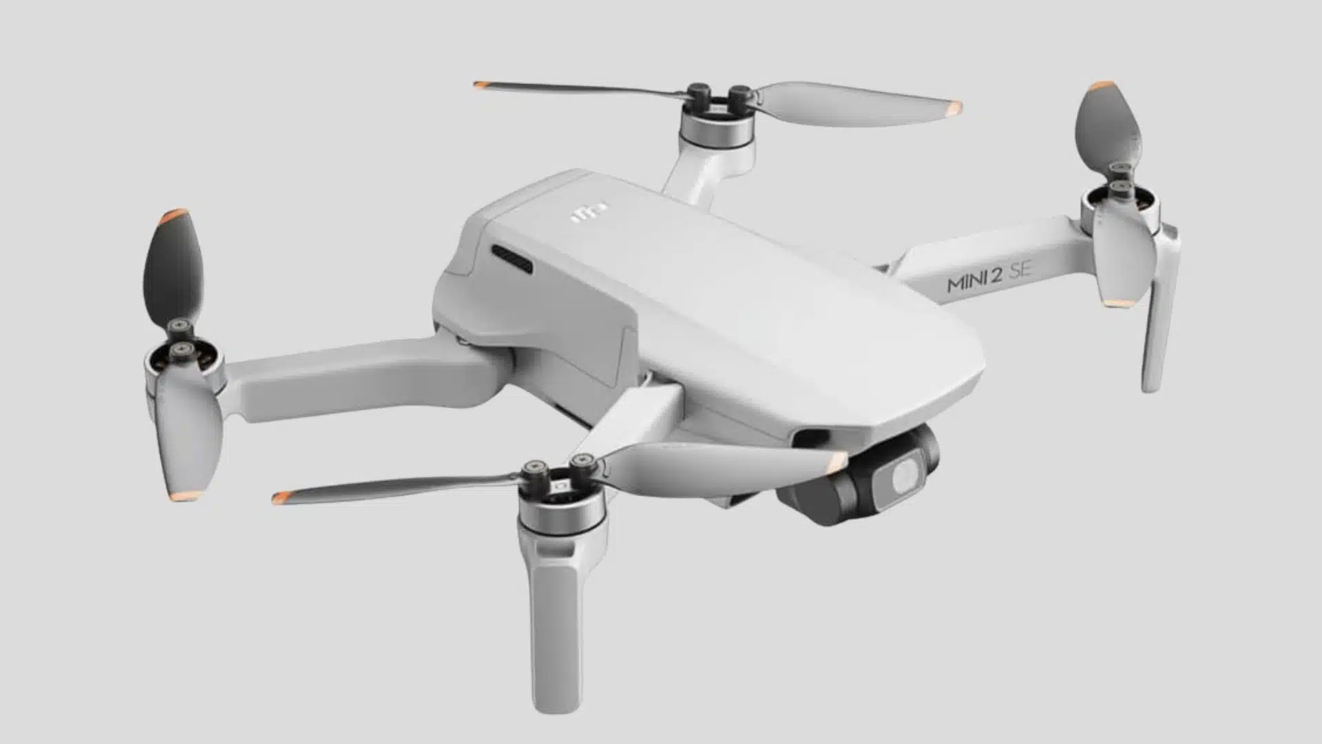 DJI Mini 2 SE camera drone with four propellers, foldable arms, and front-mounted gimbal camera