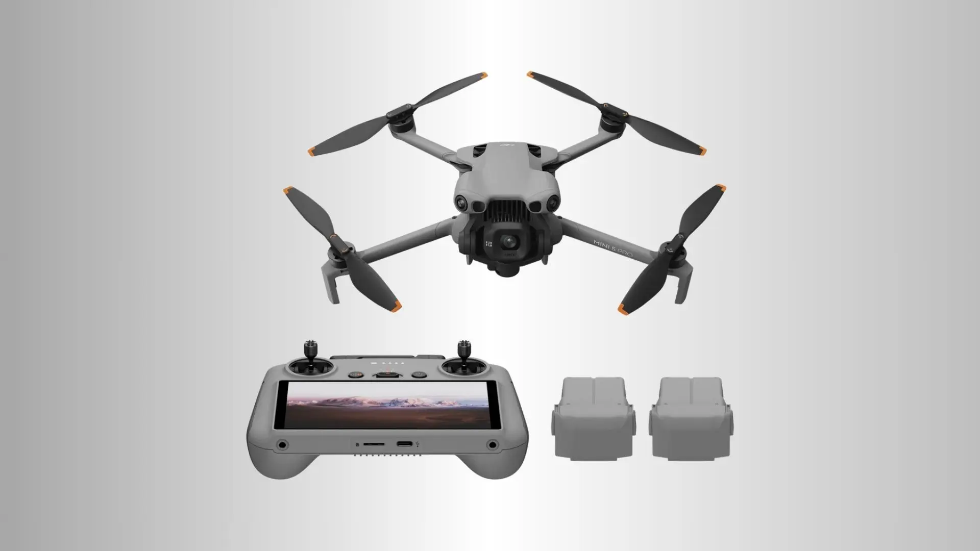 DJI Mini 5 Pro drone displayed with screen controller and two spare batteries against a clean light gray studio background