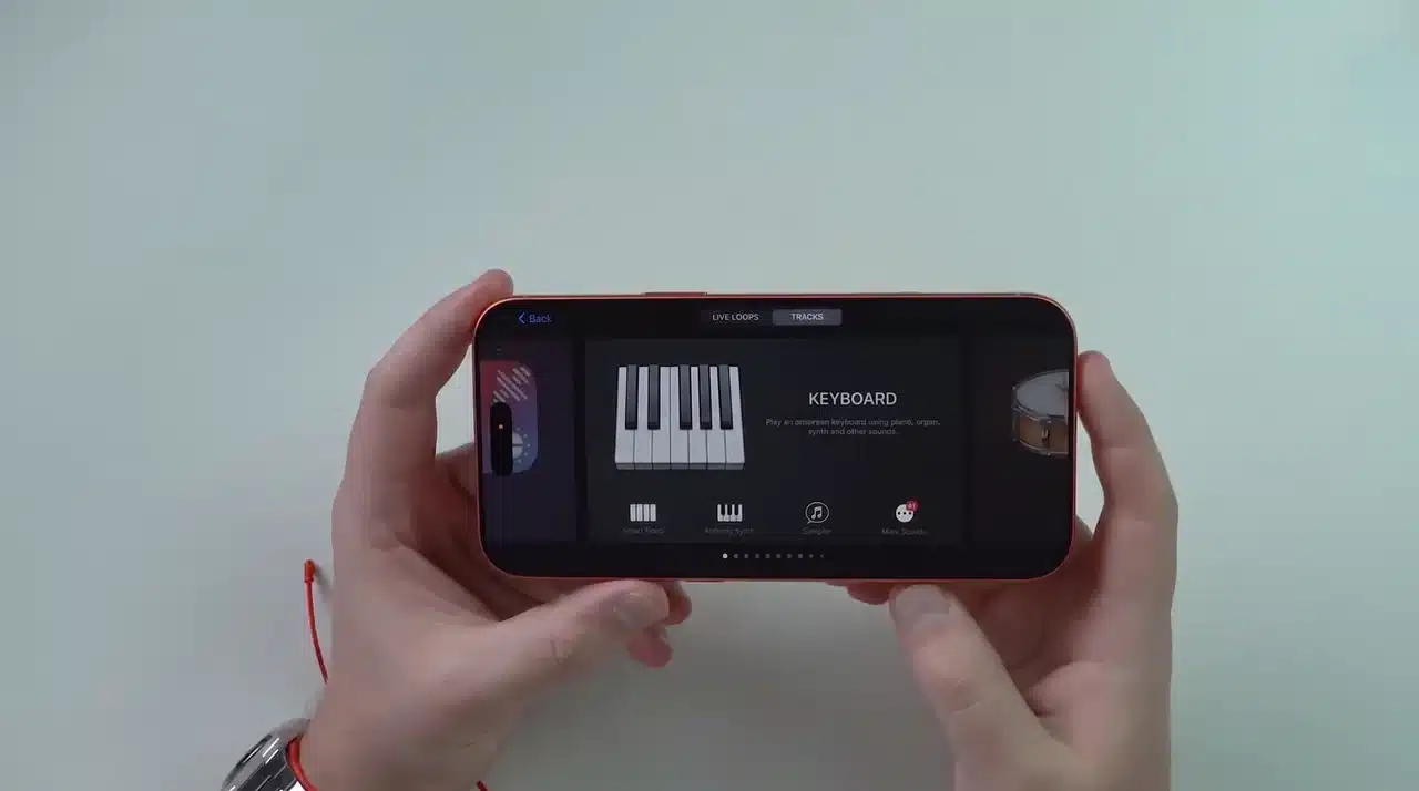 iPhone showing GarageBand app open with instrument selection screen