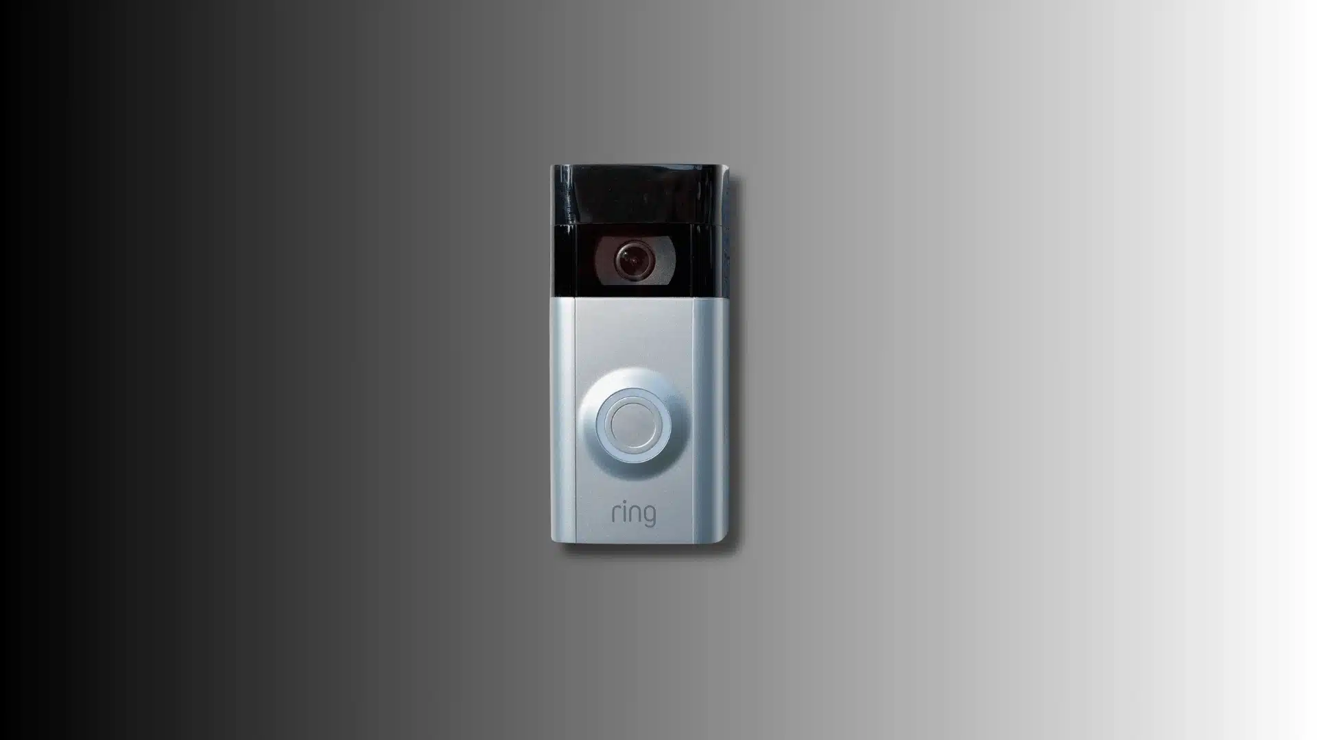 a Ring Video Doorbell on a grey background